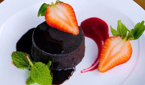 Chocolate cake with strawberry and mint Stock Photos
