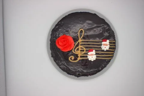 Chocolate cake on a white background. Image from above. The cake is decorated Stock Photos