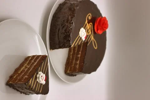 Chocolate cake on a white background. Image from above. The cake is decorated Stock Photos