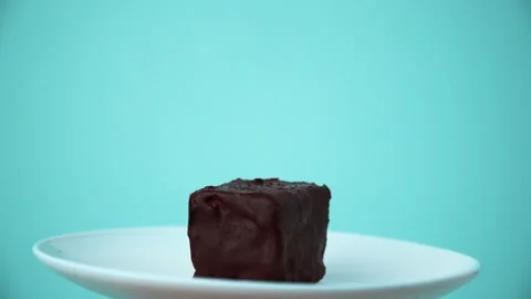 Chocolate cake on a white plate Stock Footage 133418258