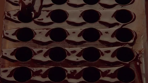 Chocolate cand mold form in process of creating candys Stock Footage 86314832