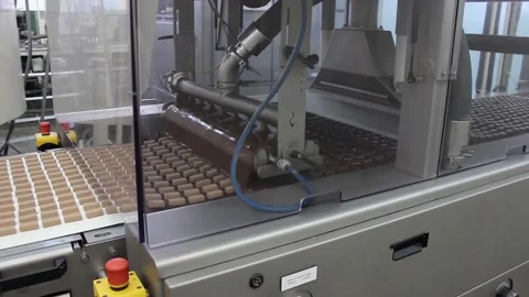 Chocolate candies 014 An automatic conveyor for the production of sweet glazed Stock Footage 133403783