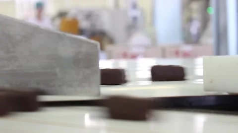 Chocolate candies 036Chocolates are sent to different conveyor belts Stock Footage 133403953