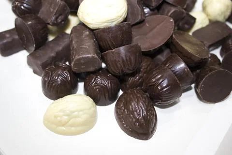 Chocolate candies of different shapes Stock Photos