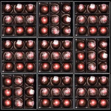Chocolate candies in giftboxes. Assorted chocolates confectionery in their gi Stock Photos