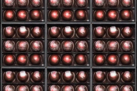 Chocolate candies in giftboxes. Assorted chocolates confectionery in their gi Stock Photos