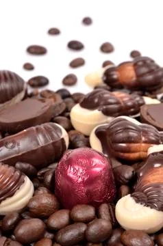 Chocolate candy with coffee beans on a white background . Stock Photos