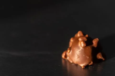 A chocolate candy with a dark background Stock Photos