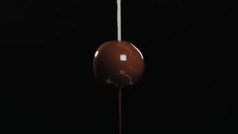 Chocolate candy dipped in melted chocolate Video stock 149147715