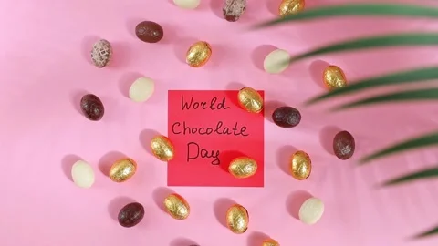 Chocolate candy eggs with a note World Chocolate Day. Stock Footage 312687595