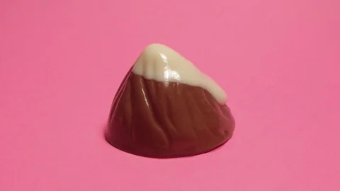 Chocolate candy melting timelapse. Mountain shape with white top 4k Stock Footage 95710094