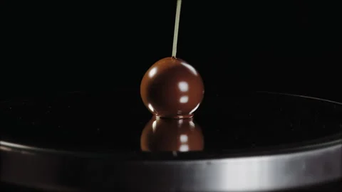 Chocolate candy on round mirror covered with walnut kernels Stock Footage 149147782