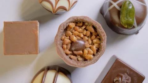 Chocolate candy set. Assorted chocolate sweets on white background. Top view. Stock Footage 150365981