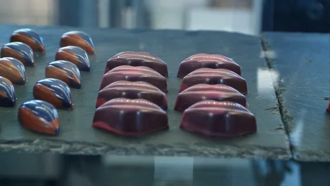 Chocolate candy in a store window Vídeos de archivo 77424275