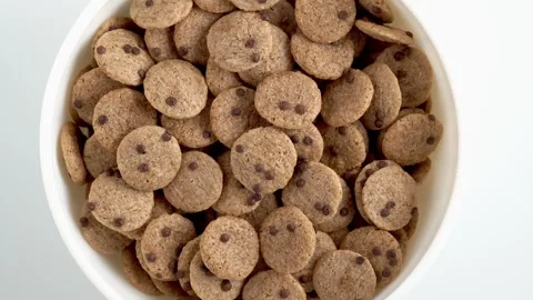 Chocolate cereal flakes rotation close up top view. . Healthy breakfast con.. Stock Footage 248209068