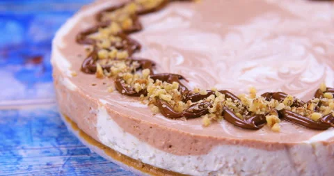 Chocolate cheesecake decorated with walnuts Stock Footage 134073692