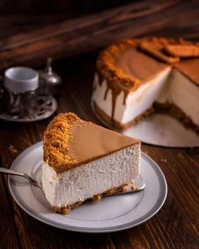 Chocolate cheesecake slice served in dish isolated on wooden table side vie.. Stock Photos