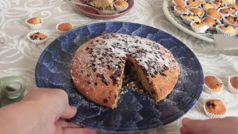 Chocolate chip cake on patterned ceramic plate. Holidays and lifestyle. Food on Stock Footage 320903324