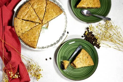 Chocolate chip cookie cake on gray background with coffee beans and gypsophila Stock Photos