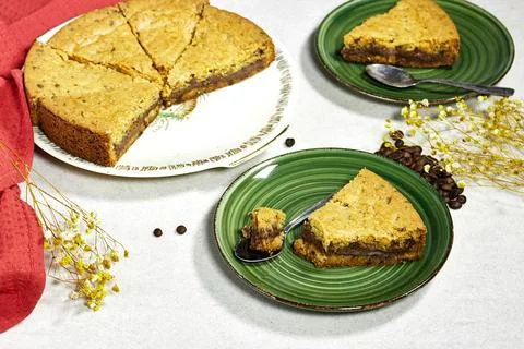 Chocolate chip cookie cake on gray background with coffee beans Stock Photos
