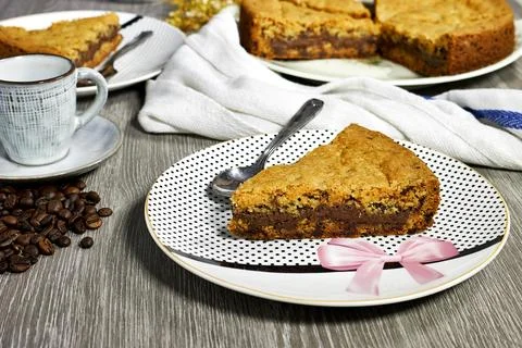 Chocolate chip cookie cake on gray background with coffee beans and gypsophila f Stock Photos