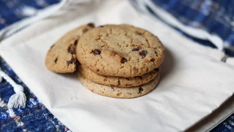 Chocolate chip cookie on carrying case. Blurry view and blur background. Stock Footage 148422304