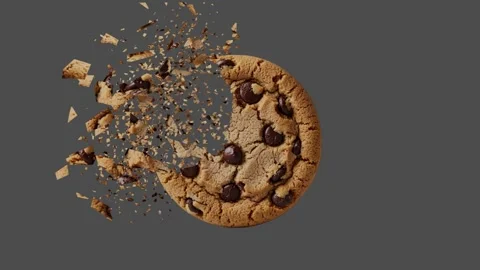 Chocolate chip cookie shattering in slow motion, high-speed food impact video Stock Footage 313949457