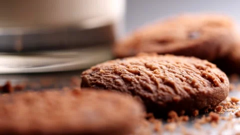 Chocolate chip cookies falling, dropping into table, slow motion Stock Footage 225900928