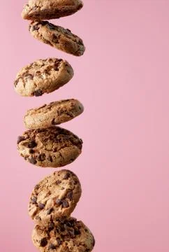 Chocolate chip cookies falling in stack Stock Photos