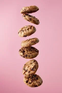 Chocolate chip cookies falling in stack Stock Photos