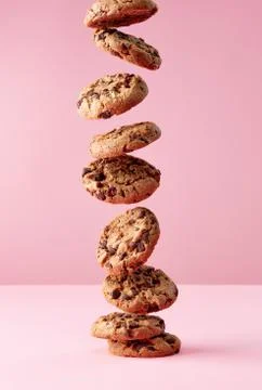 Chocolate chip cookies falling in stack Stock Photos