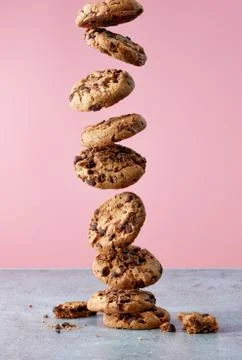 Chocolate chip cookies falling in stack Stock Photos
