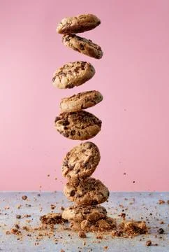 Chocolate chip cookies falling in stack Stock Photos
