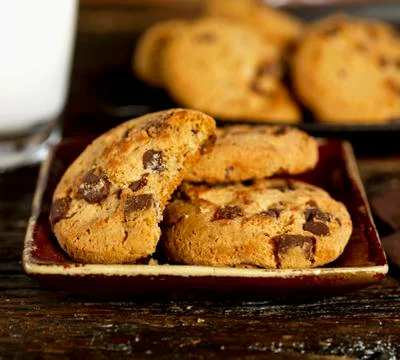 Chocolate chip cookies, one with a bite taken out Foto stock