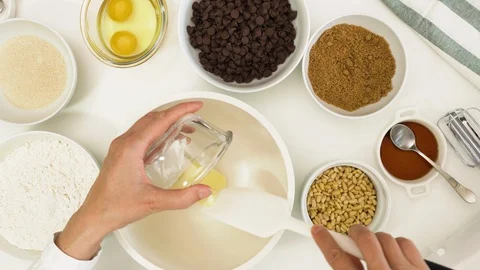 Chocolate Chip Cookies with Pine nuts. Step by step close up accelerated video Stock Footage 129603725