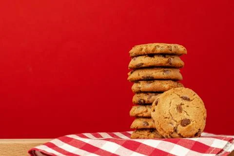 Chocolate chip cookies in stack on red background Stock Photos