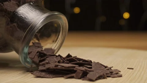 Chocolate chips for baking poured out of the bottle Stock Footage 222922553