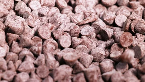 Chocolate Chips Falling and Settling Stock Footage 310818731