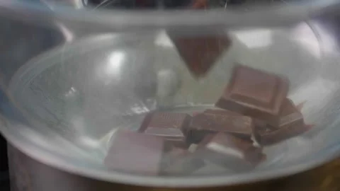 Chocolate Chunks Dropped in Bain Marie Stock Footage 166863045