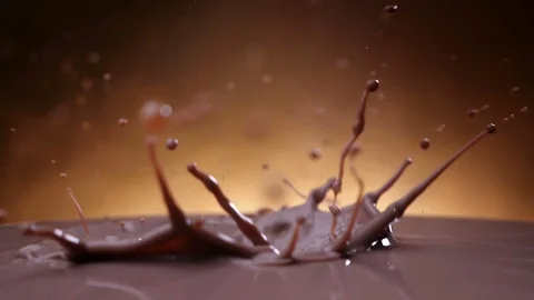 Chocolate chunks fall into chocolate milk - slow motion 스톡 동영상 102298660