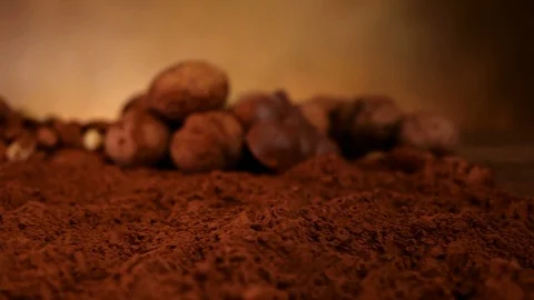 Chocolate chunks falling into cocoa, splashing - slow motion Video stock 101634242