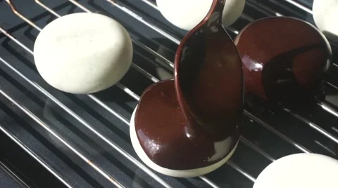 Chocolate coating is poured on the cake Stock Footage 62812241