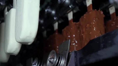 The Chocolate Coating Process Used in a Production Line for Making Various Stock Footage 312446620