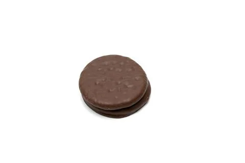A chocolate cookie is sitting on a white background 스톡 사진