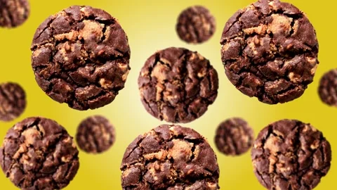 Chocolate cookies of different diameters on gradient background. 4K UHD footage Stock Footage 166412554