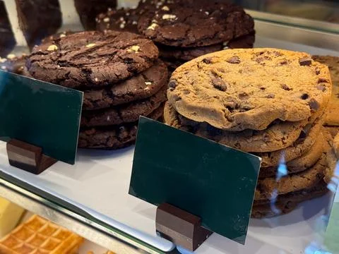 Chocolate cookies stack and bakery biscuits in showcase. Sweet snack, dessert 스톡 사진