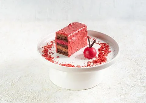 Chocolate covered cherry cake. Sponge cake with a layer of cherry jelly with  Stock Photos