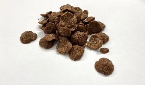 Chocolate-covered corn flakes on a white background Stock Photos