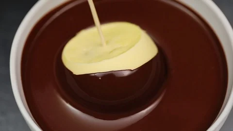 Chocolate Covered glaze Mousse Cake on dark background slow motion Stock Footage 101743377