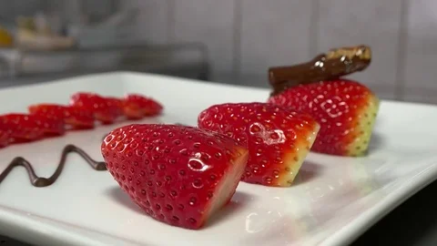 Chocolate covered grasshopper placed on a strawberry Stock Footage 83463692